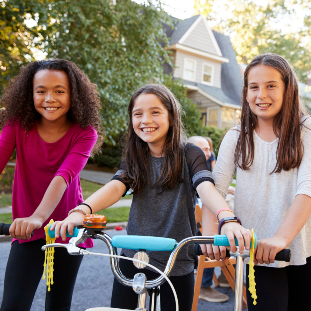 3 young kids ages 9-12 on bikes
